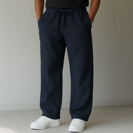 Navy linen drawstring pants with relaxed fit and side pockets — front view